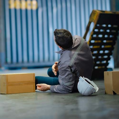 Worker fallen over in a warehouse